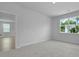 Bright, carpeted bedroom with large windows offering outdoor views at 222 Seele St, Summerville, SC 29485