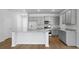 Modern kitchen with center island, stainless appliances, granite countertops, and hardwood floors at 222 Seele St, Summerville, SC 29485