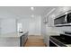 Modern kitchen featuring a large island, granite countertops, and stainless steel appliances at 222 Seele St, Summerville, SC 29485