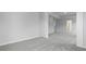 Bright bedroom showcasing neutral walls, plush gray carpeting, and doorways leading to other areas of the home at 226 Seele St, Summerville, SC 29485