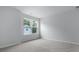 Bright bedroom with neutral carpet and a large window at 226 Seele St, Summerville, SC 29485
