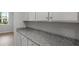 Kitchen showcasing a countertop with white cabinets, offering plenty of storage space at 226 Seele St, Summerville, SC 29485
