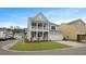 Charming two-story house showcasing a inviting double porch and attached two car garage at 226 Seele St, Summerville, SC 29485