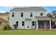 Light blue two-story home with white trim, large windows, and a screened-in porch for outdoor enjoyment at 226 Seele St, Summerville, SC 29485