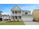 Charming two-story home with a welcoming double porch and a well-maintained front yard at 226 Seele St, Summerville, SC 29485
