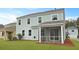 Light blue two-story home with white trim, large windows, and screened-in porch offers comfort at 226 Seele St, Summerville, SC 29485