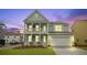 Charming two-story home with a welcoming double porch and a well-maintained front yard at 226 Seele St, Summerville, SC 29485