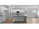 Open-concept kitchen with a spacious island, granite countertops, and modern appliances at 226 Seele St, Summerville, SC 29485