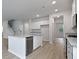 Well-lit kitchen offers stainless steel appliances, granite countertops, and a center island at 226 Seele St, Summerville, SC 29485