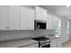 Modern kitchen features granite countertops, stainless steel appliances, and ample storage at 226 Seele St, Summerville, SC 29485