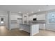 Modern kitchen features a large center island, granite countertops and white cabinets at 226 Seele St, Summerville, SC 29485