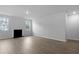 Bright living room with hardwood floors, a fireplace, and two windows offering natural light at 226 Seele St, Summerville, SC 29485