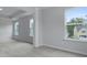 Spacious living room with carpeted floors, natural light, and column features, creating an inviting space at 226 Seele St, Summerville, SC 29485