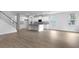 Spacious living room with hardwood floors adjacent to the kitchen with natural light at 226 Seele St, Summerville, SC 29485