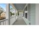 The spacious porch showcases architectural details and a neighborhood view at 226 Seele St, Summerville, SC 29485