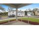 Screened-in porch offering views of the street and neighborhood homes at 226 Seele St, Summerville, SC 29485