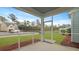 Screened-in porch overlooking the well-manicured backyard and a pond at 226 Seele St, Summerville, SC 29485