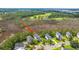 An aerial view of a home in a lush, green neighborhood, close to a golf course and waterway at 2301 N Creek Dr, Mount Pleasant, SC 29466