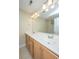 Bathroom featuring double sinks, wooden cabinets, and a large mirror at 2301 N Creek Dr, Mount Pleasant, SC 29466