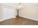 Bedroom featuring ceiling fan, flooring and double door closet at 2301 N Creek Dr, Mount Pleasant, SC 29466