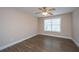 Bedroom features a ceiling fan, hardwood floors, and large window with blinds at 2301 N Creek Dr, Mount Pleasant, SC 29466