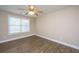Bright bedroom features wood-look floors, large window, and a modern ceiling fan at 2301 N Creek Dr, Mount Pleasant, SC 29466
