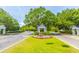 Beautiful community entrance with well-manicured landscaping and mature trees at 2301 N Creek Dr, Mount Pleasant, SC 29466