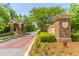 Brick entrance to Rivertowne Country Club with lush landscaping and brick-paved pathway at 2301 N Creek Dr, Mount Pleasant, SC 29466