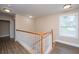 Hallway with wood railing and white spindles that leads to the second floor at 2301 N Creek Dr, Mount Pleasant, SC 29466