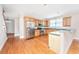Kitchen featuring stainless steel appliances, ample wood cabinetry, granite countertops, and hardwood flooring at 2301 N Creek Dr, Mount Pleasant, SC 29466