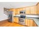 Spacious kitchen featuring ample wood cabinetry, granite countertops, and modern stainless steel appliances at 2301 N Creek Dr, Mount Pleasant, SC 29466