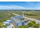 Aerial view of condo complex, marshlands, waterway, with highway and pool amenity at 2393 Folly Rd # 1G, Folly Beach, SC 29439