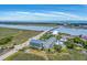 Picturesque aerial view of coastal condos near a bridge, showcasing marsh and waterfront living at 2393 Folly Rd # 1G, Folly Beach, SC 29439
