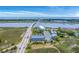 Magnificent aerial view of seaside condos by a bridge, offering serene water and coastal vistas at 2393 Folly Rd # 1G, Folly Beach, SC 29439