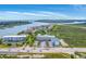 Breathtaking aerial view of coastal condos with a pool near a picturesque waterway and beach at 2393 Folly Rd # 1G, Folly Beach, SC 29439