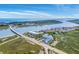 Aerial view of waterfront condos near a bridge, showcasing marsh views and coastal serenity at 2393 Folly Rd # 1G, Folly Beach, SC 29439