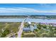 Scenic aerial perspective of coastal condos, a bridge and nearby ocean offering a tranquil setting at 2393 Folly Rd # 1G, Folly Beach, SC 29439