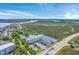 Breathtaking aerial view of marsh and waterway near community featuring pool and highway access at 2393 Folly Rd # 1G, Folly Beach, SC 29439