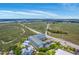 Aerial view showcasing condos near a scenic marshland and waterway, plus a highway at 2393 Folly Rd # 1G, Folly Beach, SC 29439