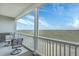 Relax on this cozy balcony with seating and a stunning view of the marsh at 2393 Folly Rd # 1G, Folly Beach, SC 29439