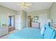 Green bedroom with ceiling fan and multiple ensuite bathrooms at 2393 Folly Rd # 1G, Folly Beach, SC 29439
