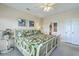 Comfortable bedroom boasts a ceiling fan and an ensuite bathroom at 2393 Folly Rd # 1G, Folly Beach, SC 29439