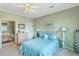 Bedroom with ceiling fan and ensuite bathroom at 2393 Folly Rd # 1G, Folly Beach, SC 29439