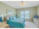 Guest bedroom featuring a ceiling fan, TV, and natural light at 2393 Folly Rd # 1G, Folly Beach, SC 29439