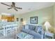 Living room with dining area, kitchen view, beach decor, and comfortable furnishings at 2393 Folly Rd # 1G, Folly Beach, SC 29439