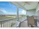 Relax on the spacious screened porch with comfortable seating and scenic views at 2393 Folly Rd # 1G, Folly Beach, SC 29439