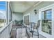 The screened porch has ceiling fan and comfortable seating with nice views at 2393 Folly Rd # 1G, Folly Beach, SC 29439