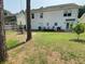 Spacious backyard with white siding and a lawn and patio area at 243 Trickle Dr, Summerville, SC 29483