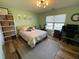 Bright bedroom featuring green walls, exercise equipment, and plenty of natural light at 243 Trickle Dr, Summerville, SC 29483