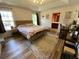 Serene bedroom with a tray ceiling, natural light, and a decorative rug at 243 Trickle Dr, Summerville, SC 29483